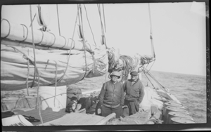 Image of Two men aboard, aft